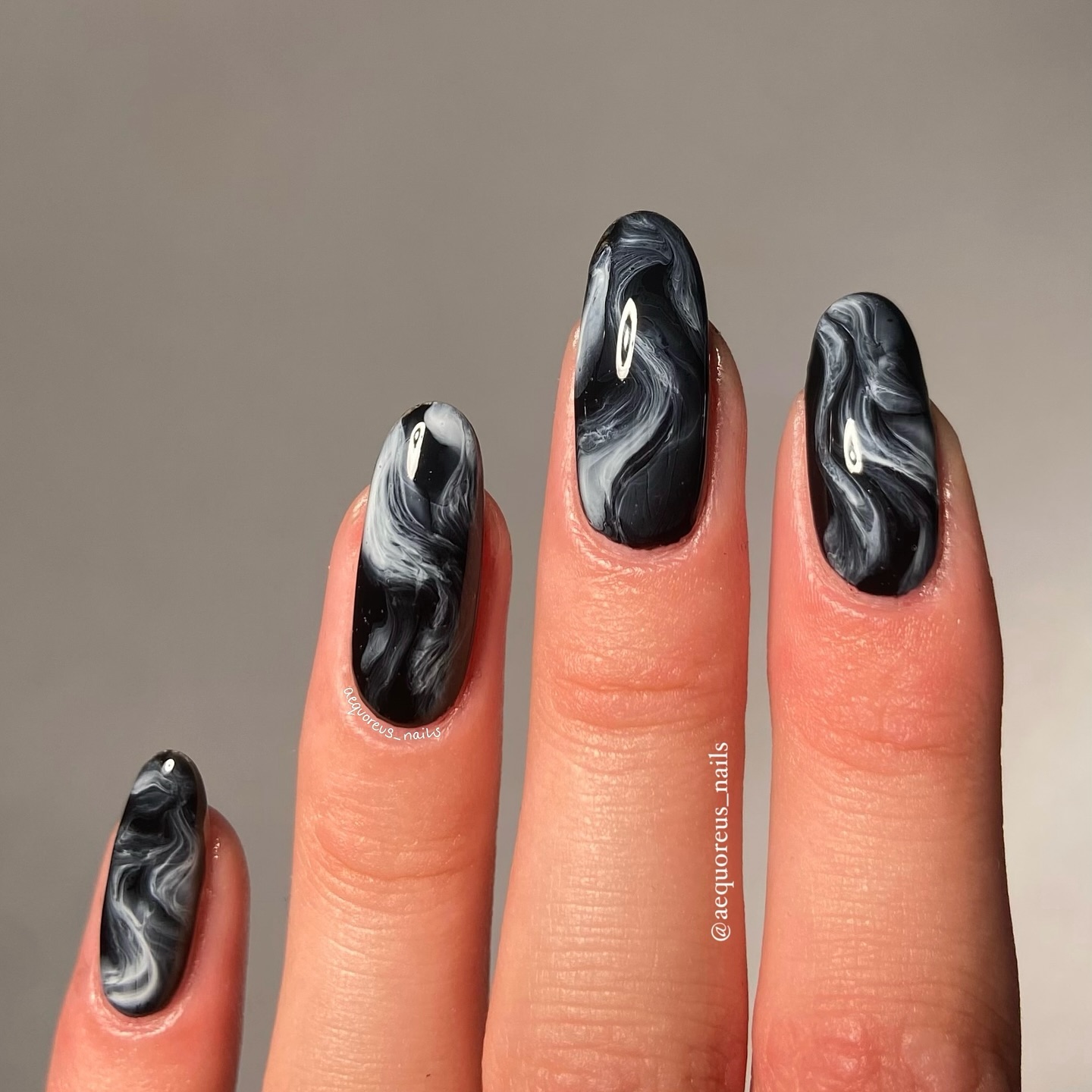 44. Whispers Of Winter: Marbled Night Sky Nail Art