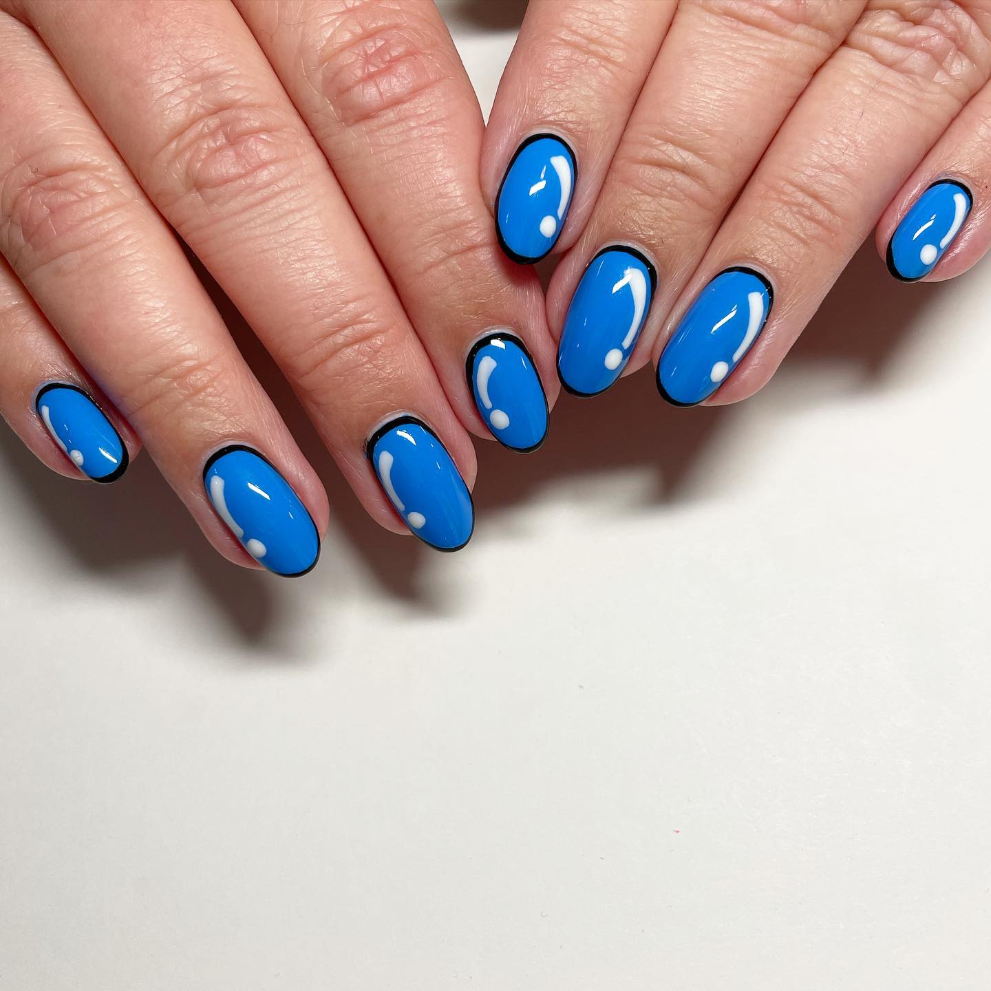 6. Bold Blue Perspectives: Comic-inspired Nail Art That Makes a Splash