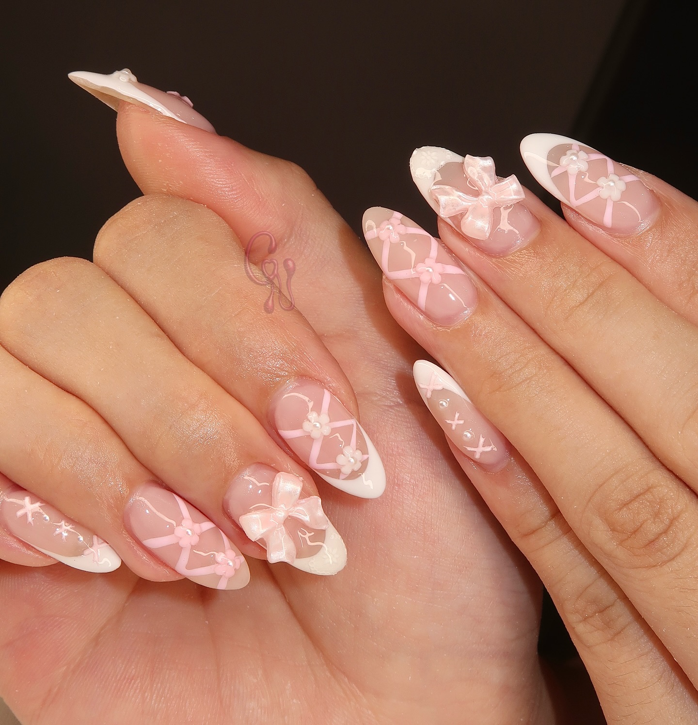 7. Whimsical Whispers Of Pink: a Bow-tied Nail Fantasy