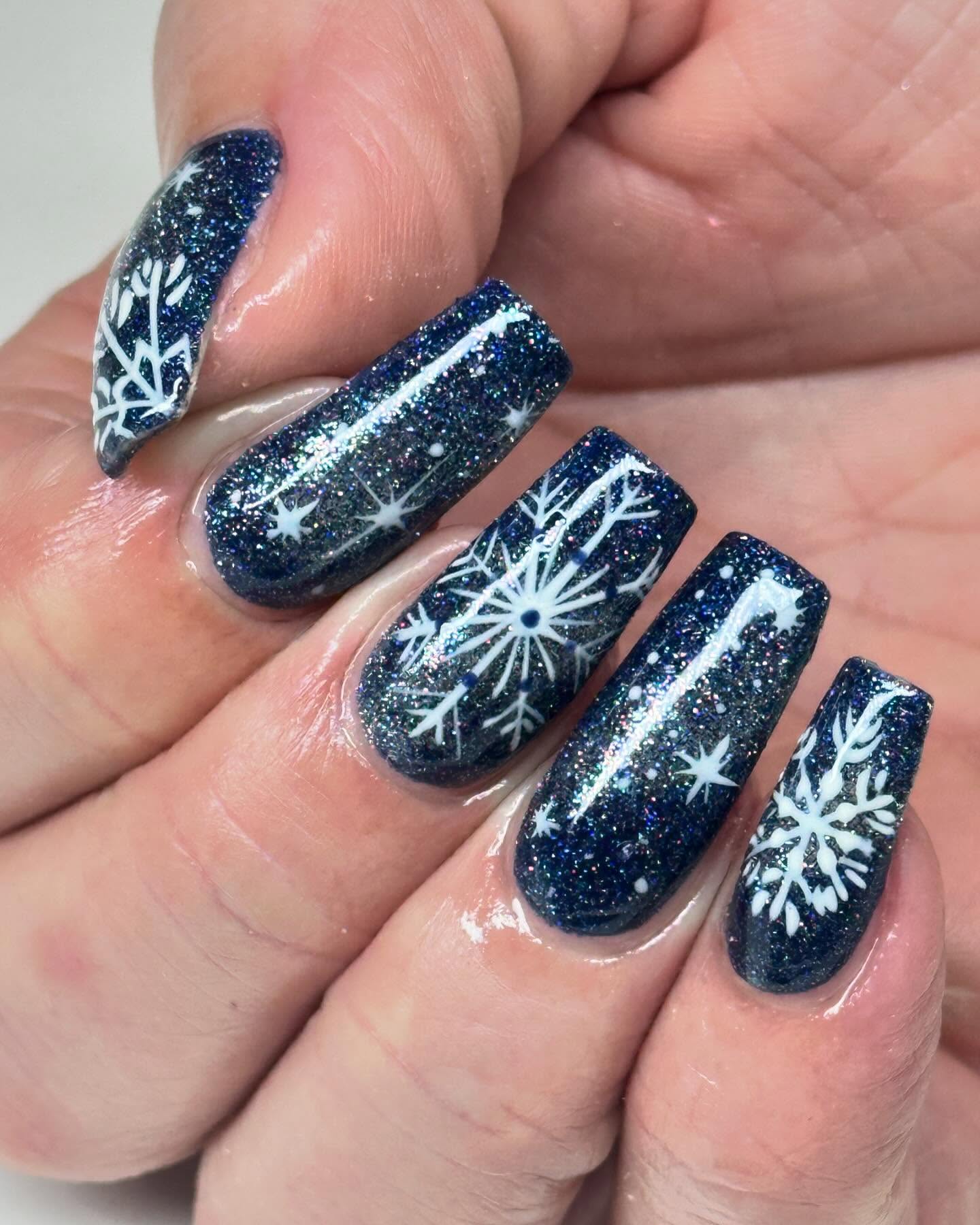 3. Twinkling Winter Wonderland: Galaxy-infused Snowflakes