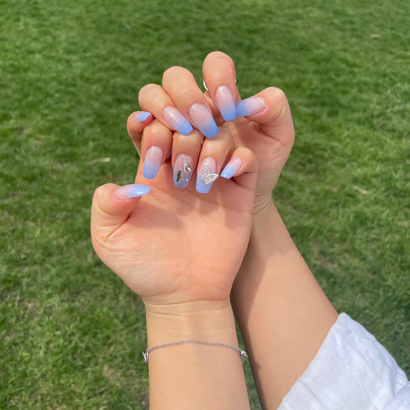 20. Blue Sky Dreams: Ethereal Ombre with Sparkling Accents