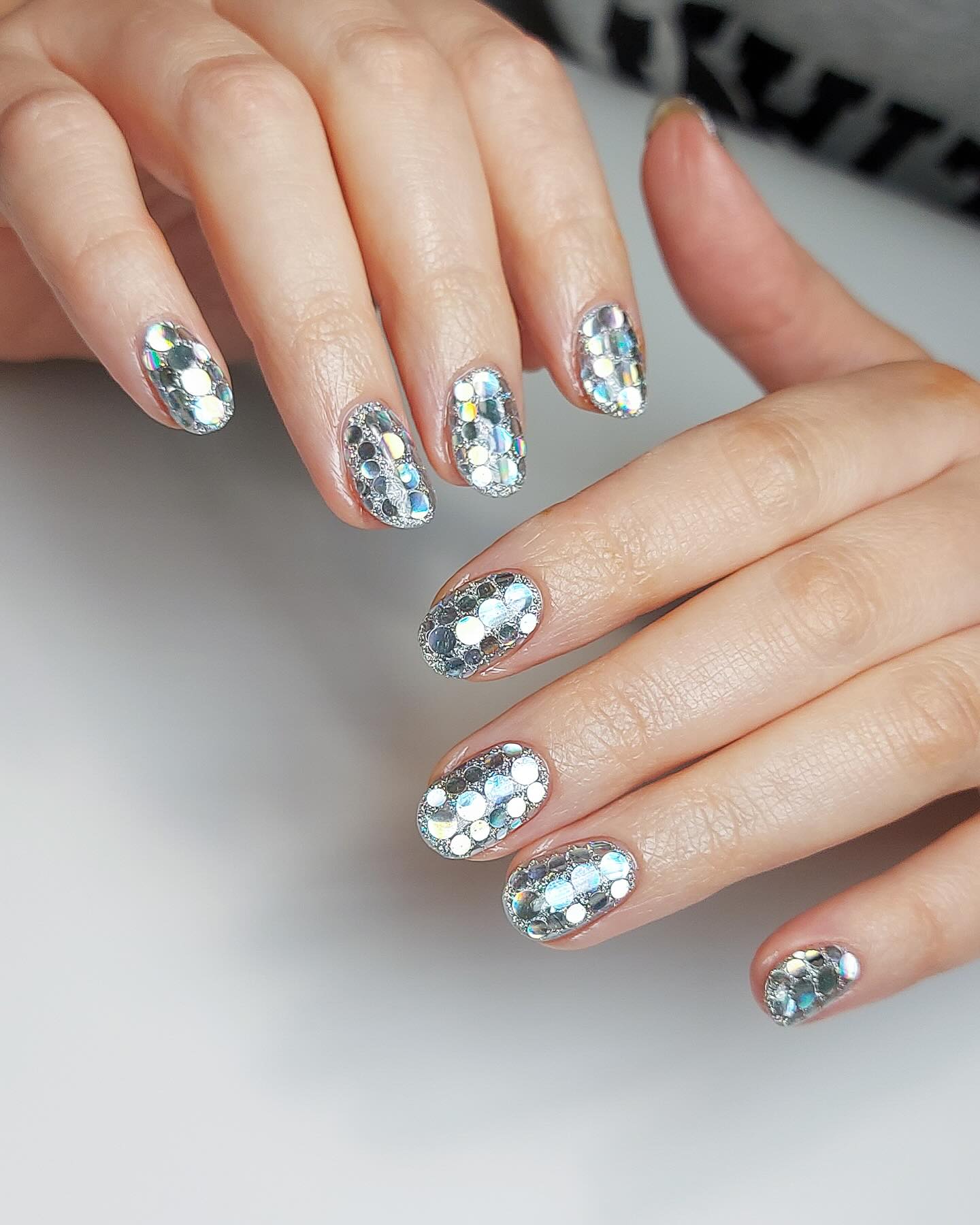 12. Celestial Disco: Dazzling Nail Art with Holographic Accents