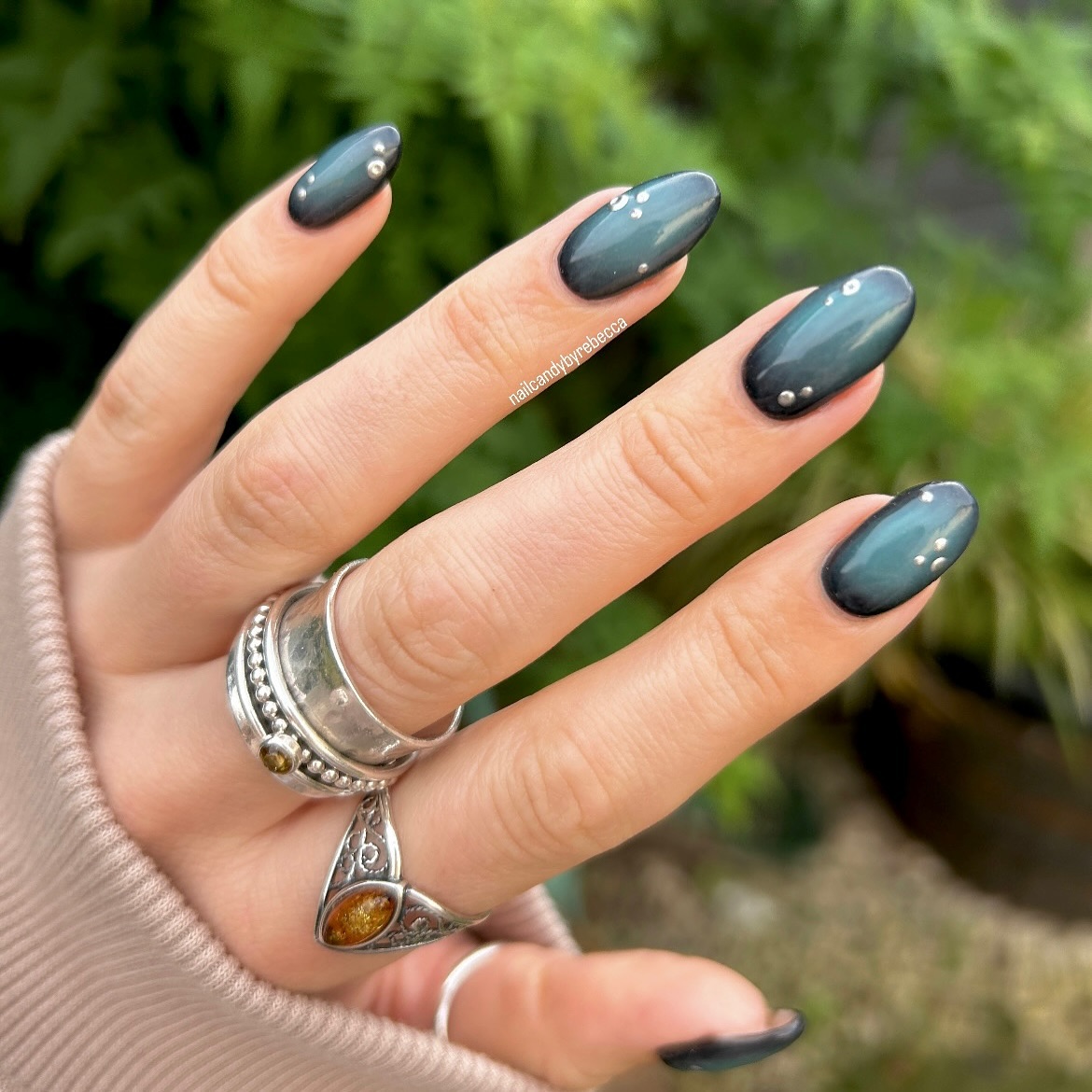 25. Mystical Jewel-toned Elegance: a Nail Art Revolution