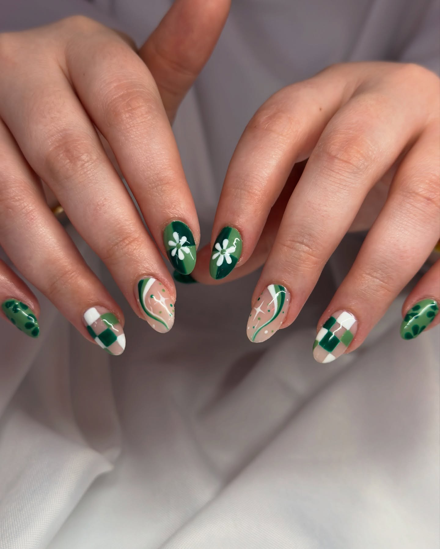 12. Emerald Whimsy: Nature-inspired Nail Art for Spring Adventures