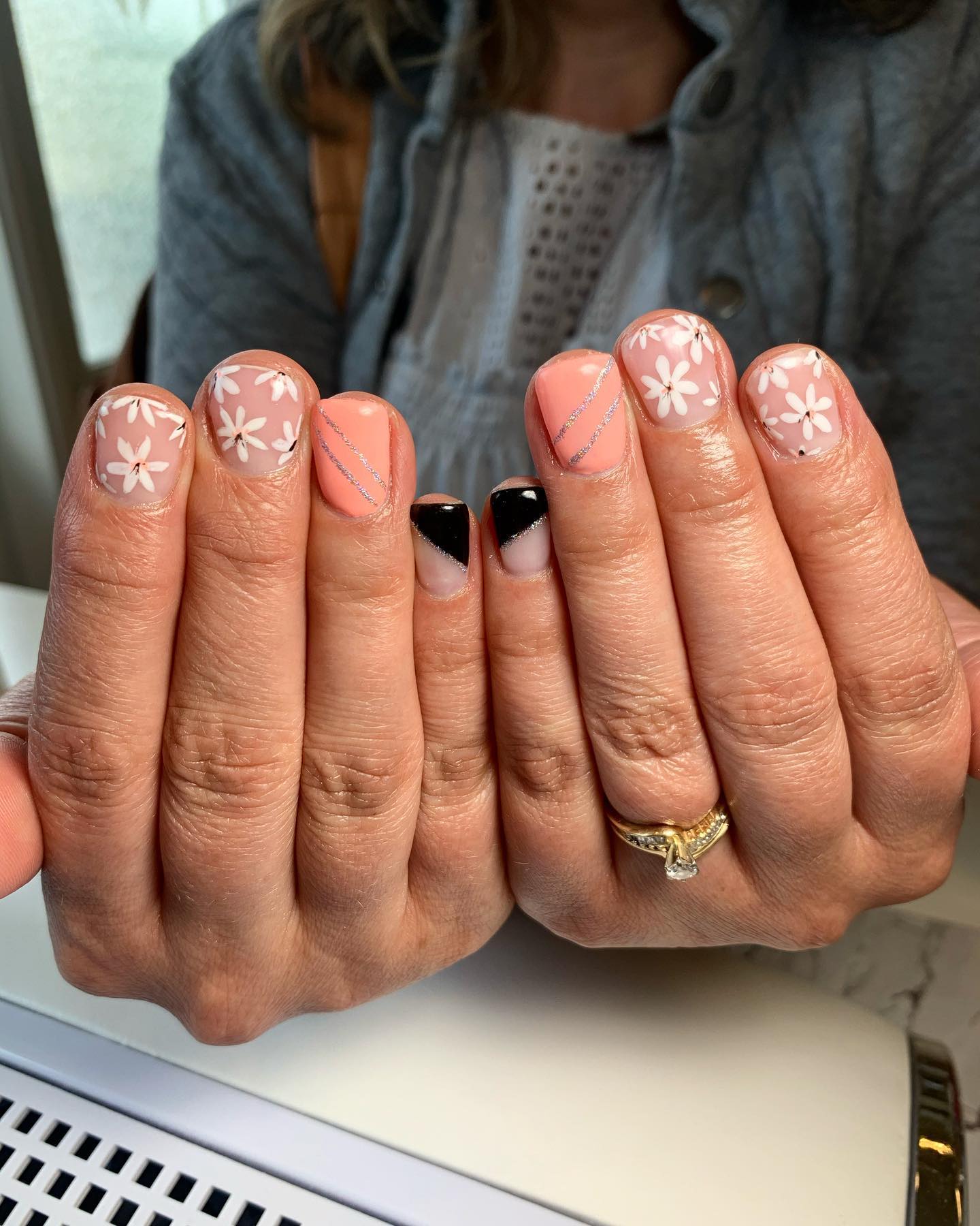 24. Floral Elegance Meets Bold Contrast: a Nail Art Symphony