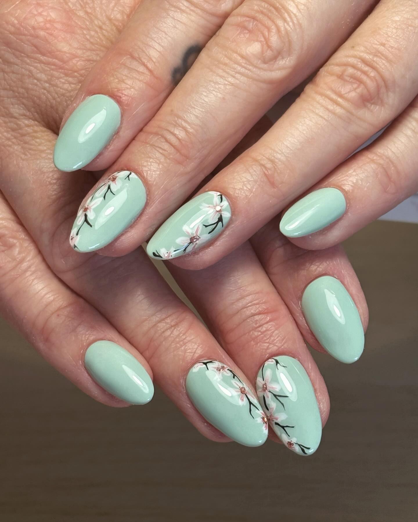 25. Whispers Of Spring: Sage Serenity with Delicate Blossoms