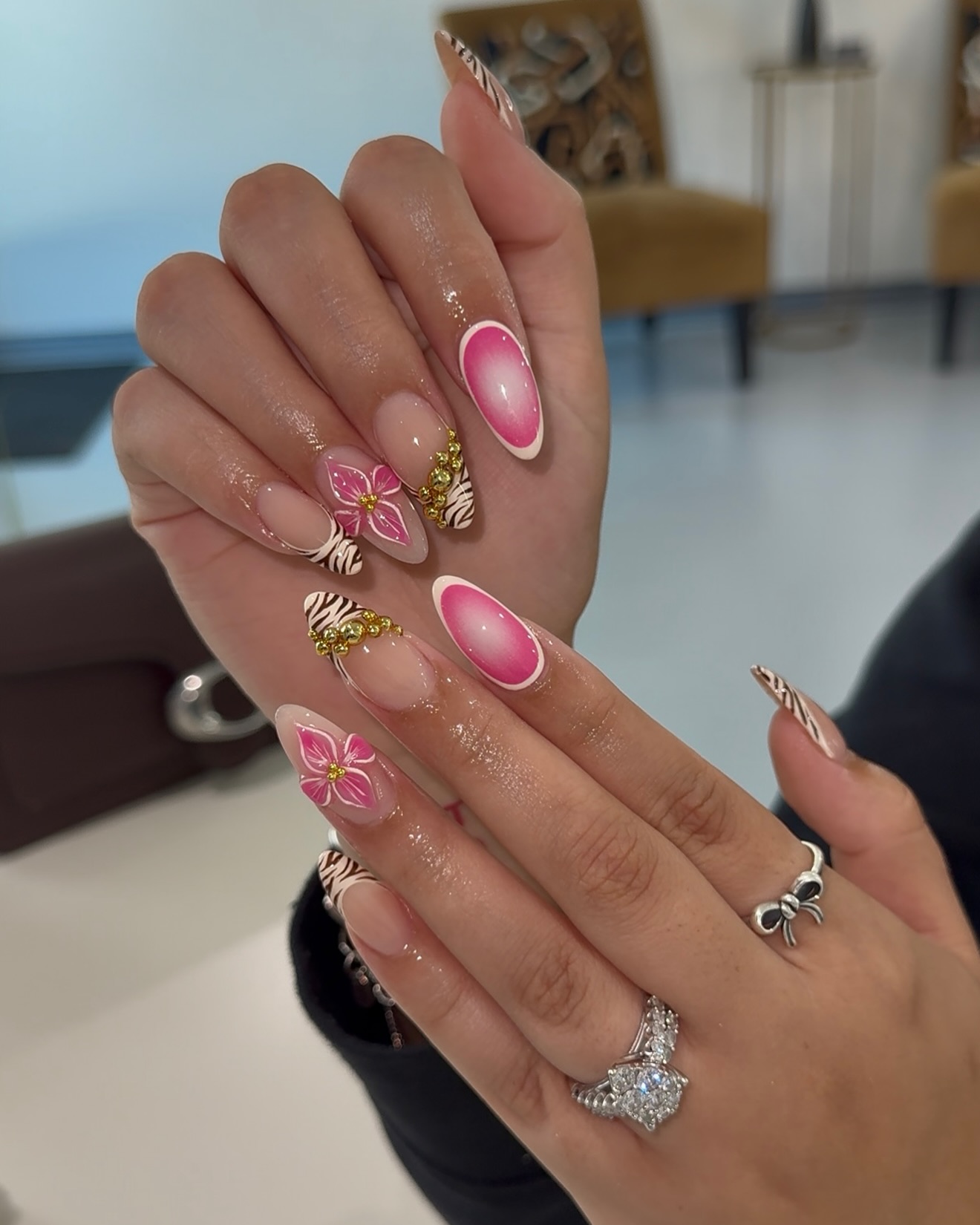 11. Tropical Chic with a Bold Twist: Floral and Zebra Fusion French Tips