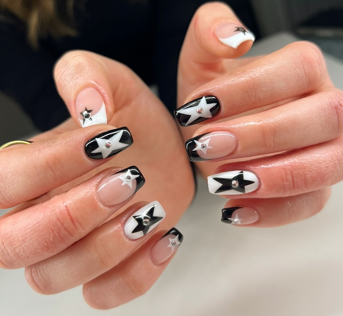 31. Starstruck Elegance: a Monochrome Nail Art Extravaganza
