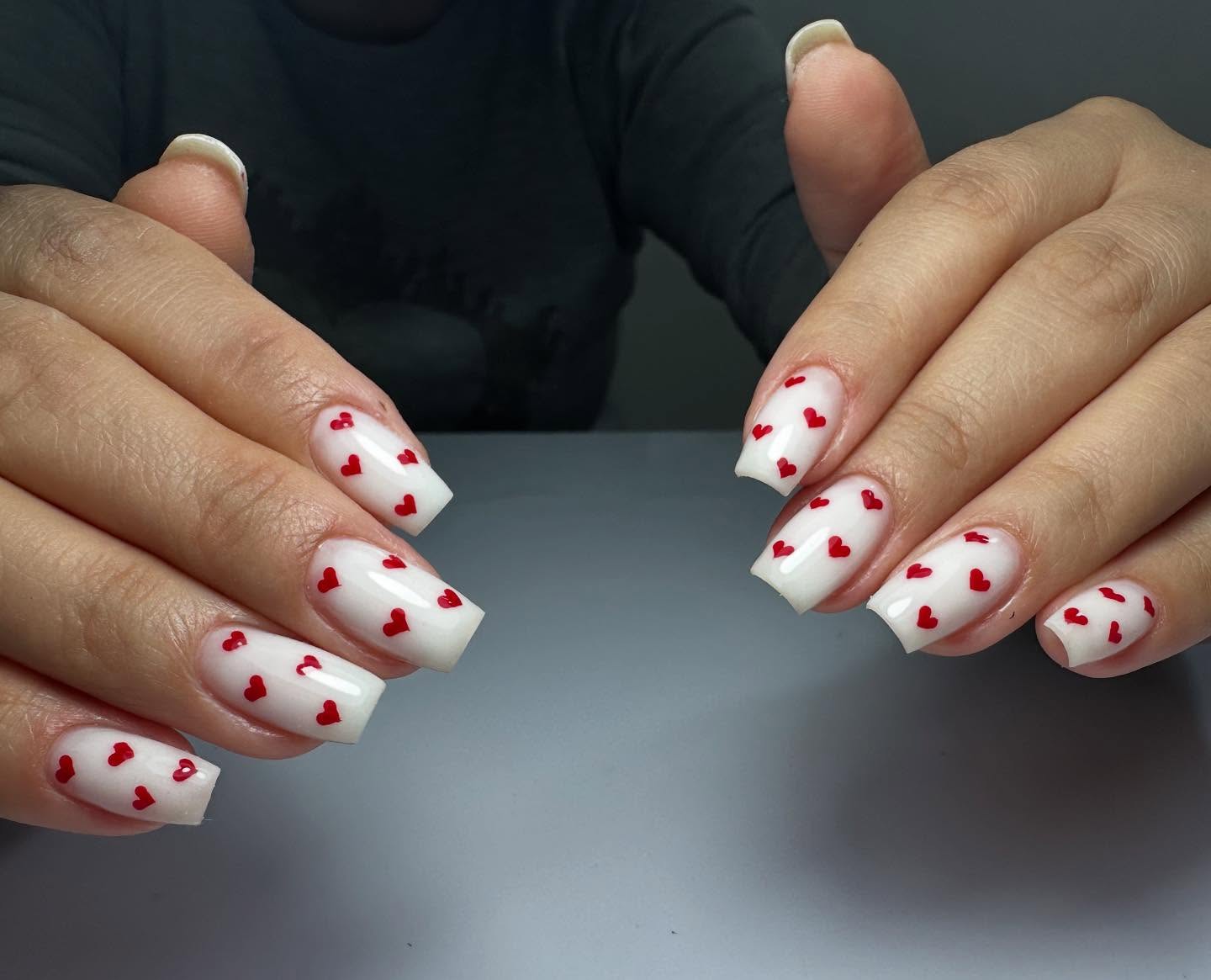 24. Cupid's Playful Palette: Whimsical Hearts on a Pure Canvas