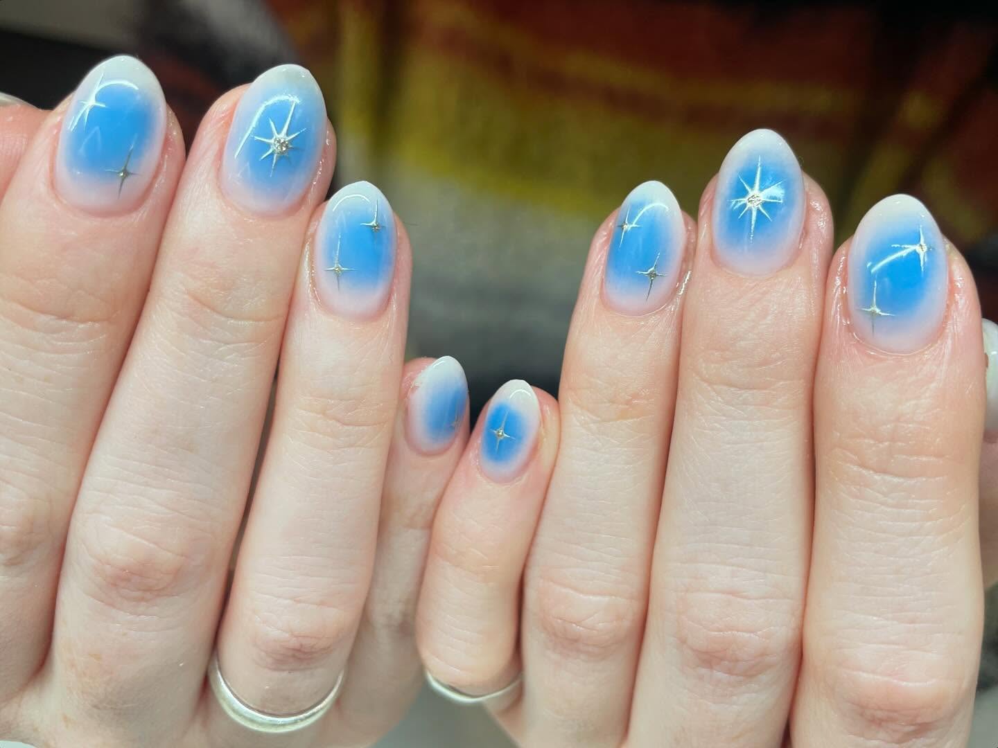 49. Celestial Winter Bliss: Frosted Starry Night Nails