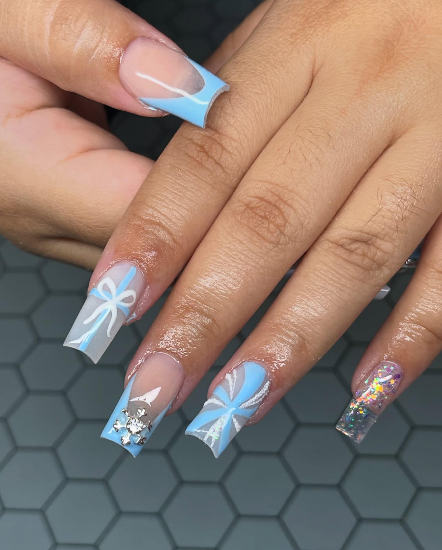 25. Frosted Whimsy: a Delicate Dance Of Snowflakes and Satin Bows