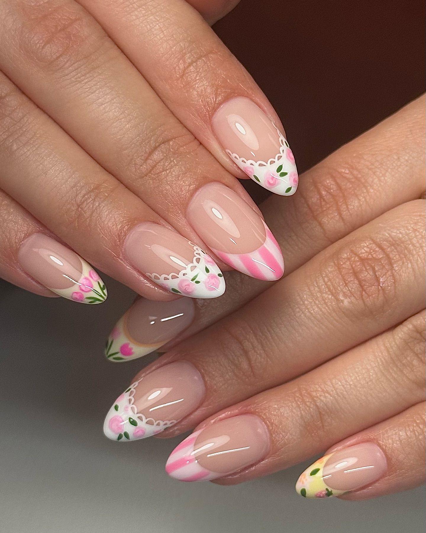 29. Floral Lace and Candy Stripes: a Whimsical Spring Nail Delight