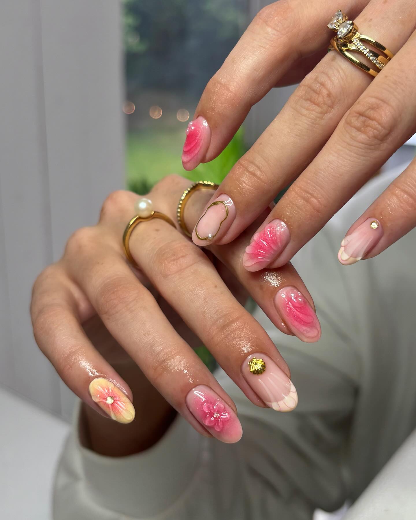 42. Tropical Petals and Gleaming Gold: a Nail Canvas Of Bold Blossoms