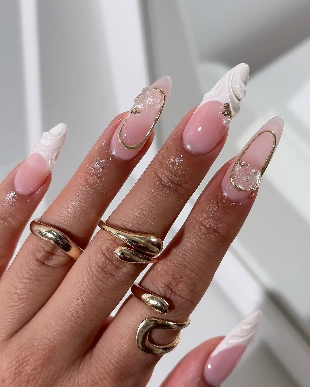 41. Whimsical Elegance: Sculpted French Tips with a Modern Twist