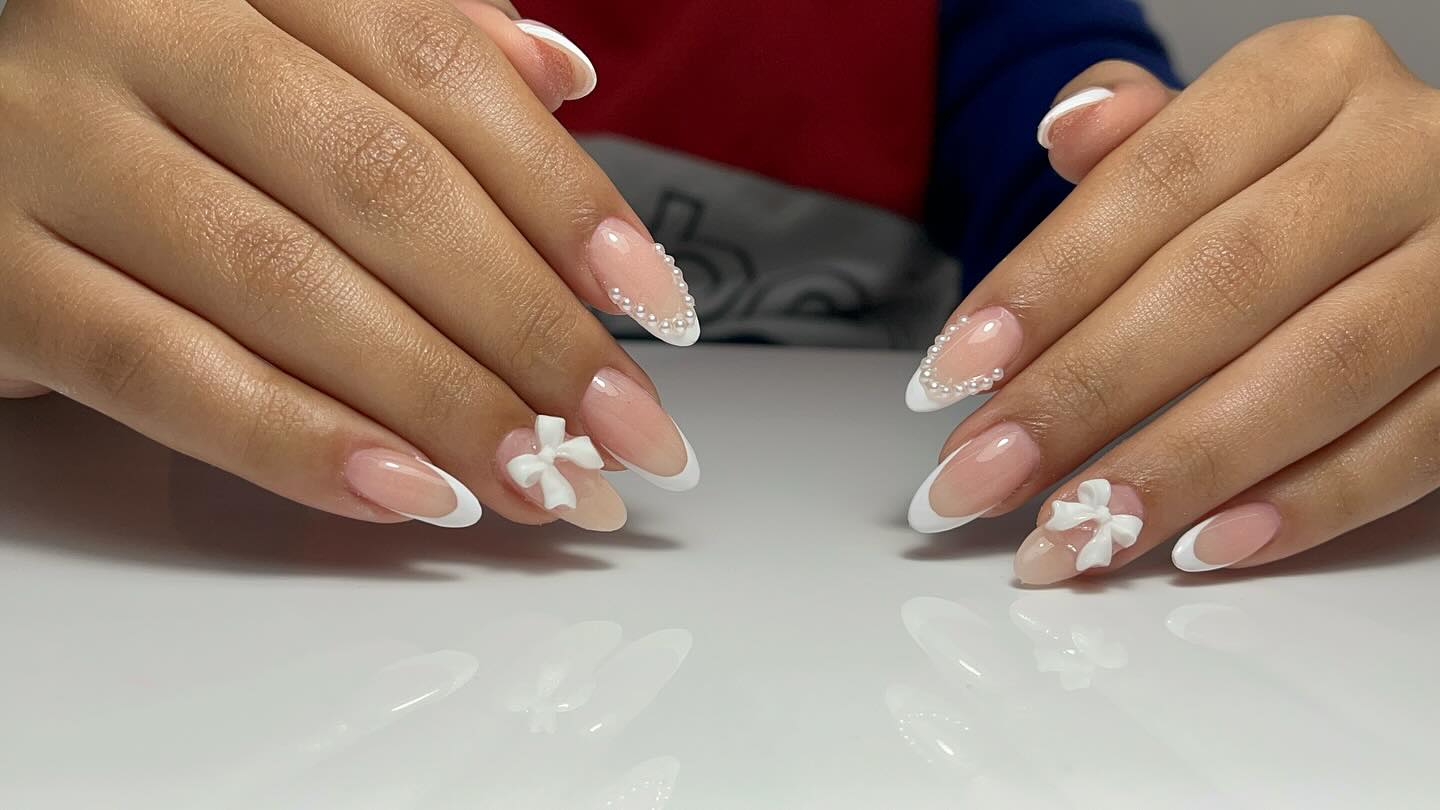 21. Whimsical Elegance: Pearls and Bows In Perfect Harmony