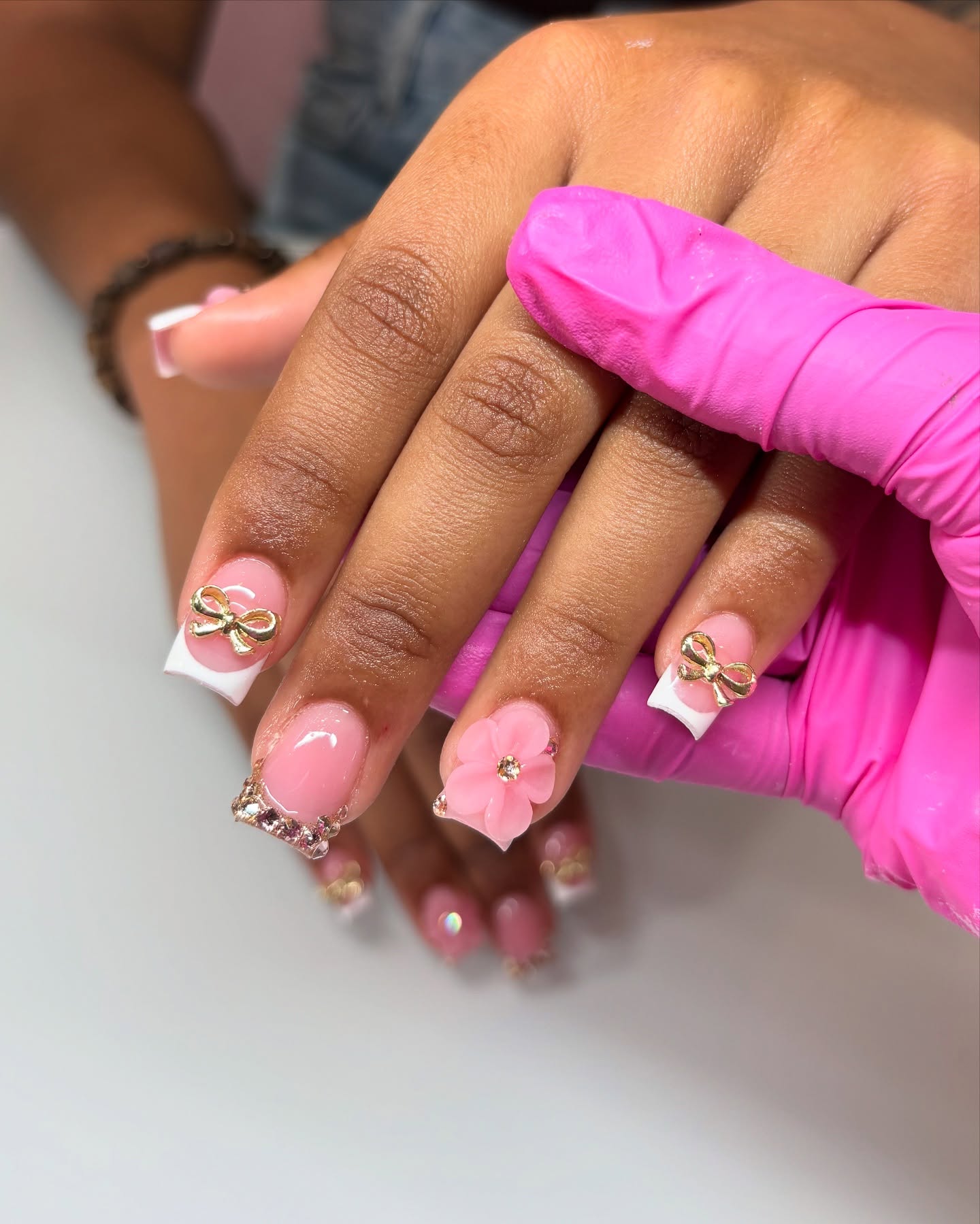 44. Petals and Bows: a Whimsical Twist on French Tips