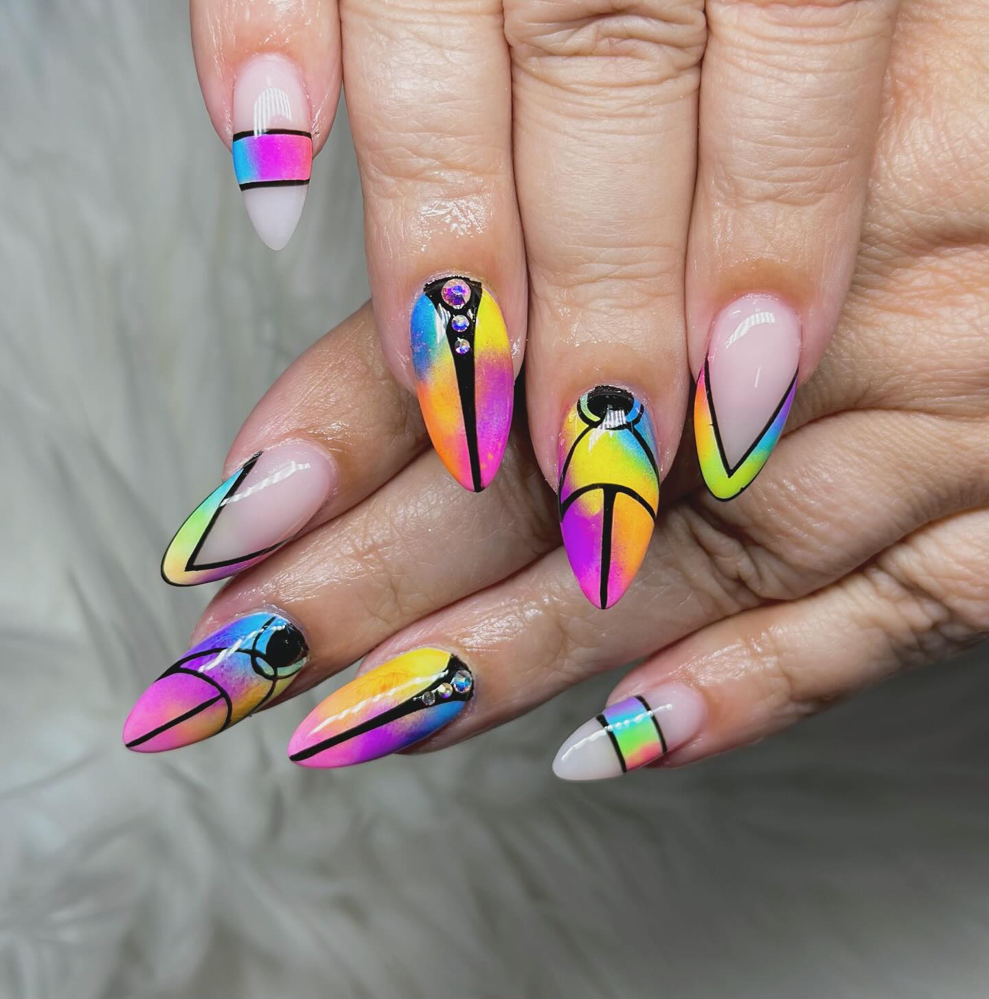 3. Kaleidoscopic Dreams: Neon Fantasy Nails with Graphic Precision